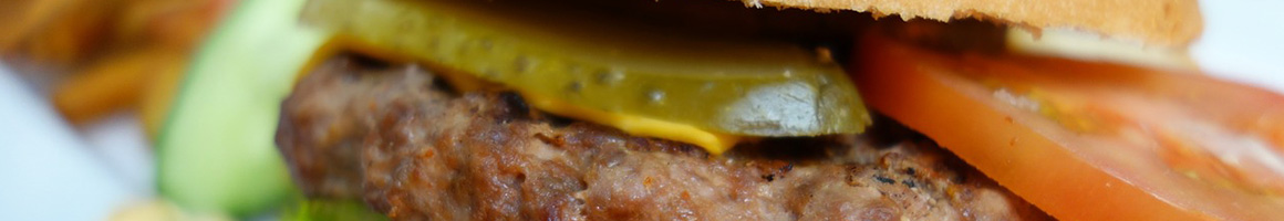 Eating Burger Sandwich at Haystack Burgers and Barley restaurant in Richardson, TX.